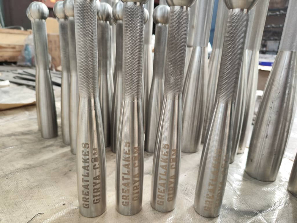 Stainless steel club examples showing engraved bodies and knurled handles