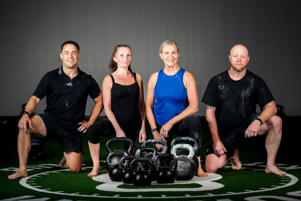 Colin Lake with participants and kettlebells at a Durham workshop